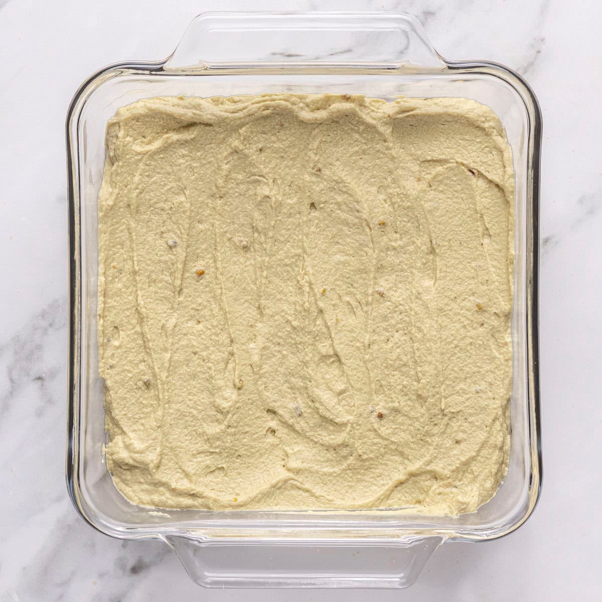 After spreading half of the pistachio mascarpone cream.