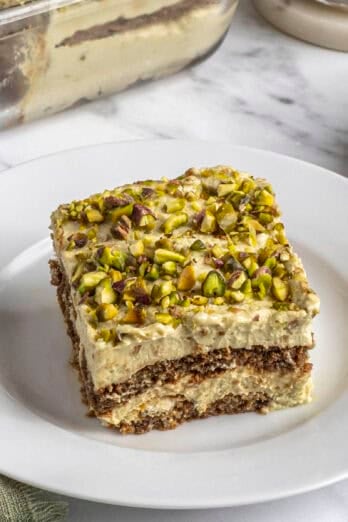 Slice of homemade pistachio tiramisu on a plate.