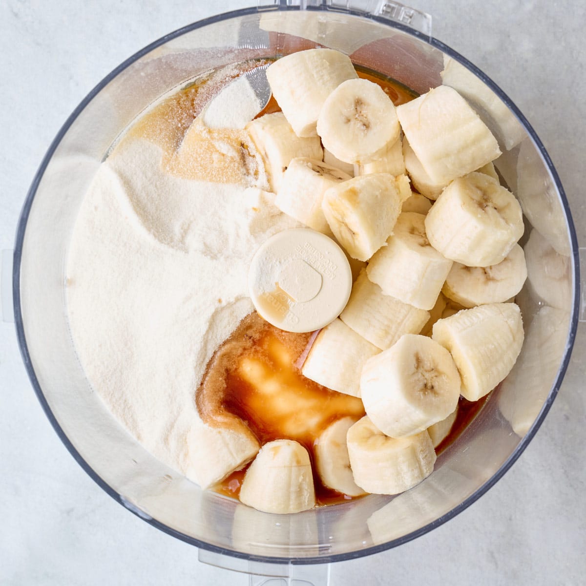 Frozen bananas, yogurt, vanilla protein powder, honey and vanilla extract in a food processor.