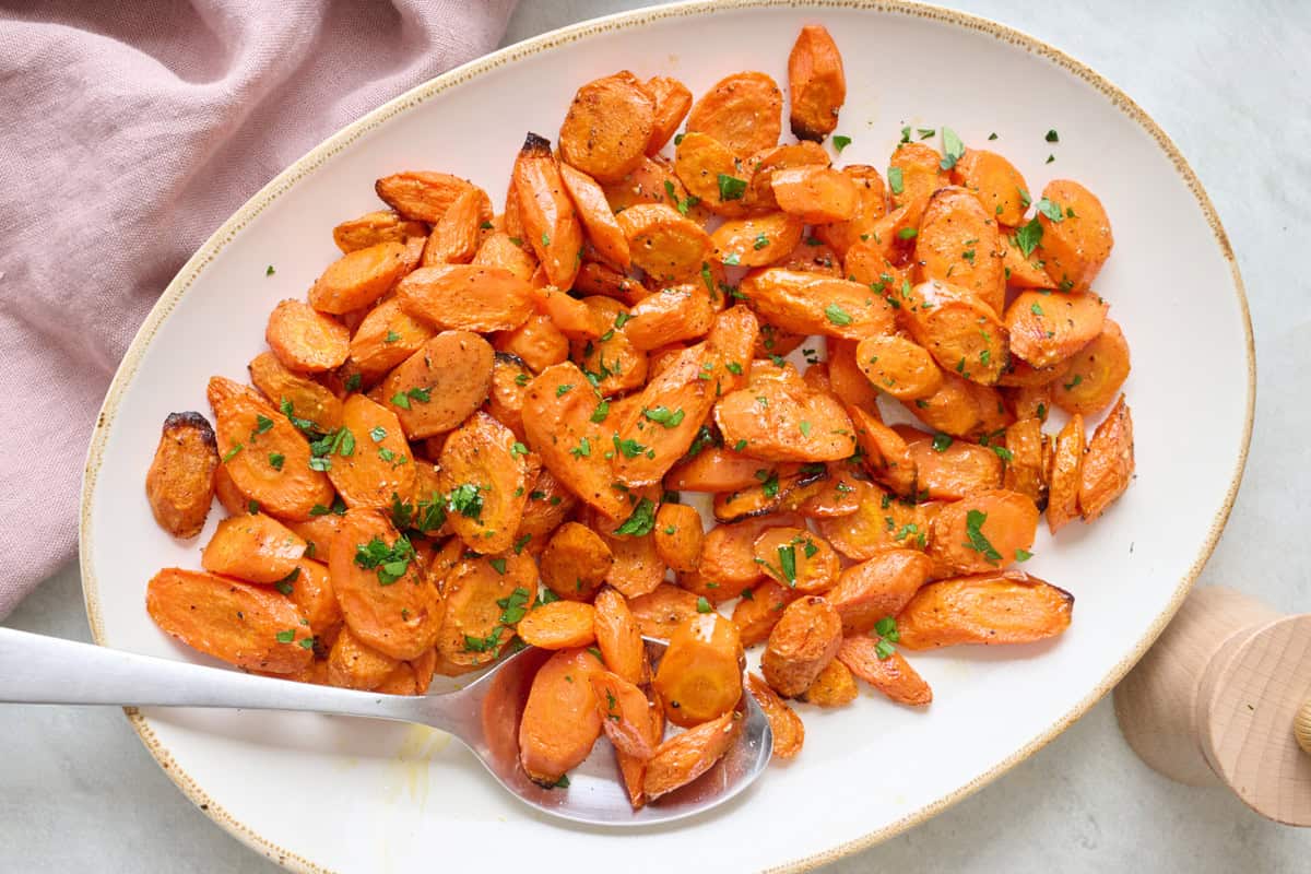 Glazed oven roasted carrots on a platter.