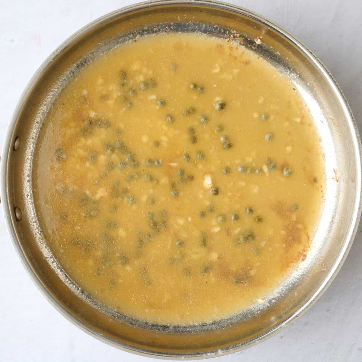 Broth capers and lemon juice added.