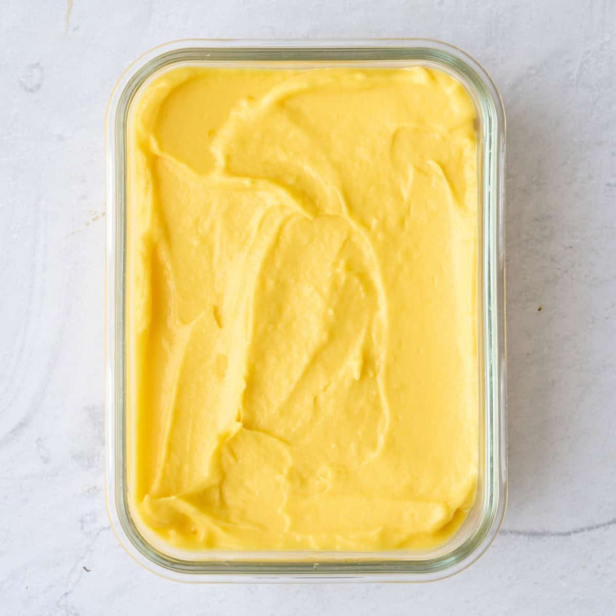 Recipe in a freezer safe glass dish before freezing.
