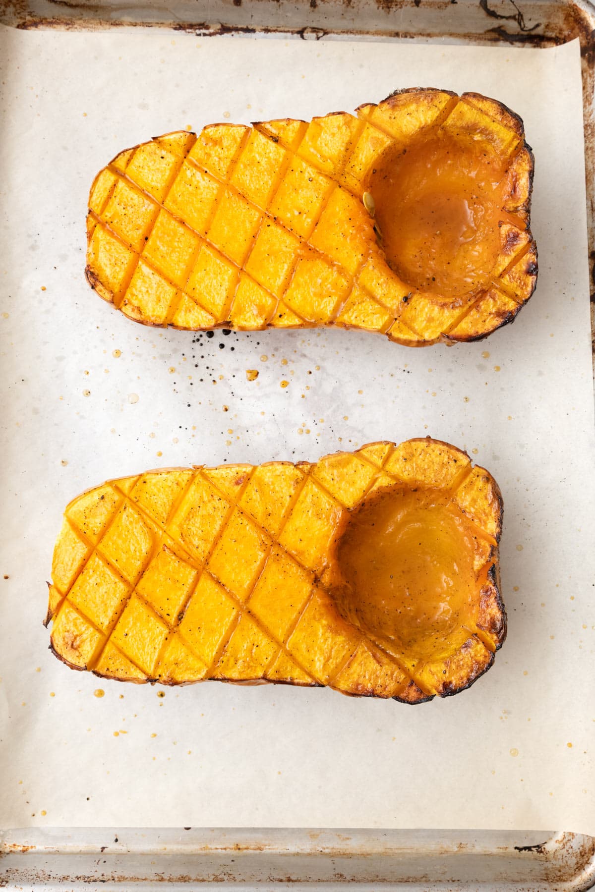Recipe after roasting to show caramelized squash flesh.