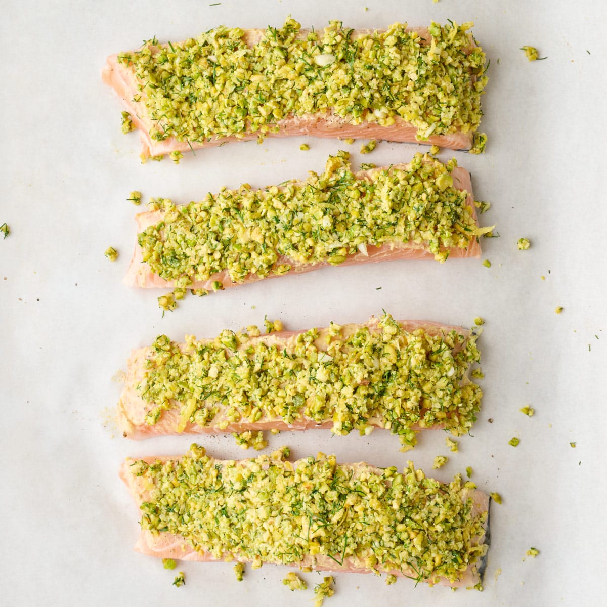 Pistachio mixture pressed firmly on top of each fillet.