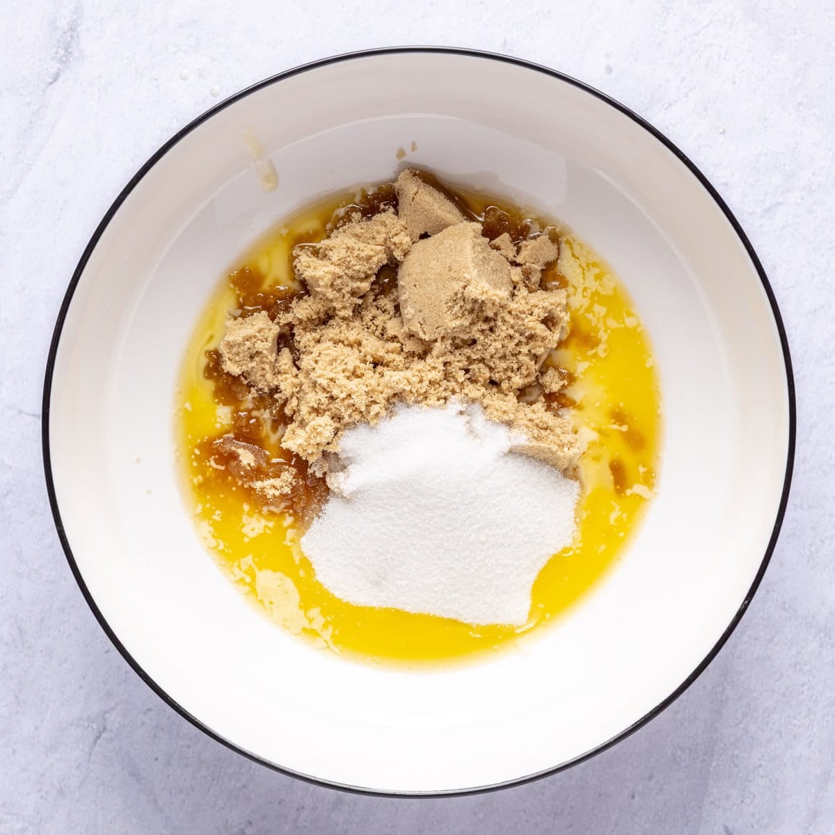 Melted butter, brown sugar and granulated sugar in a mixing bowl.