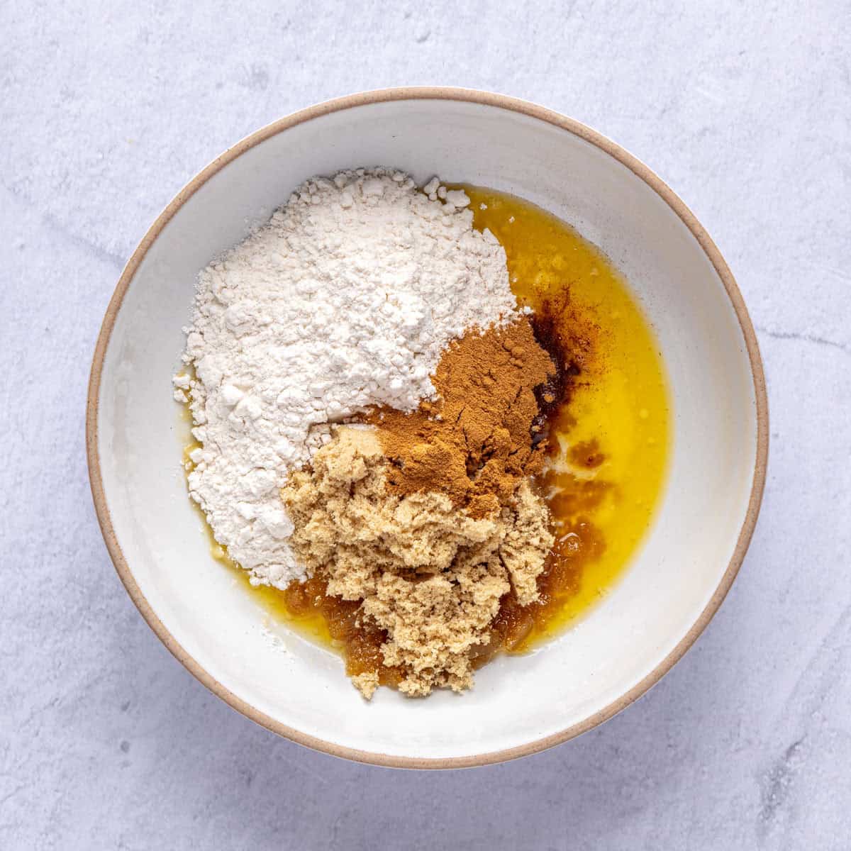Melted butter, flour, brown sugar and cinnamon in a small bowl.