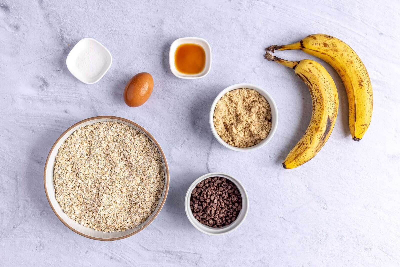 Ingredients for recipe: ripe bananas, light brown sugar, egg, vanilla, quick oats, salt and mini chocolate chips.