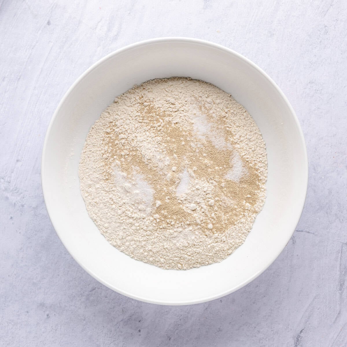 Flour, yeast and salt in a large bowl before combining.