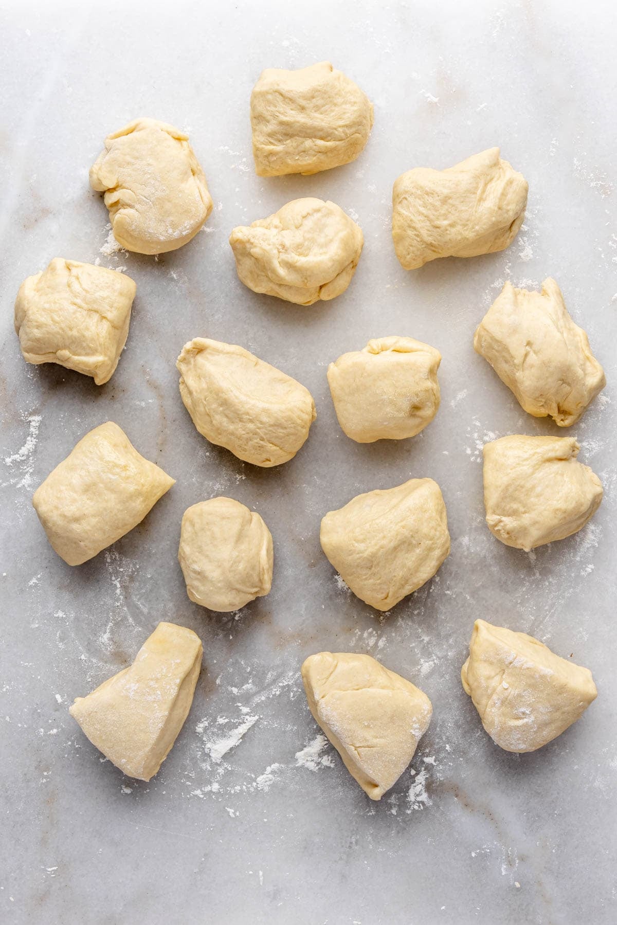 Dinner roll dough cut into 15 even pieces.