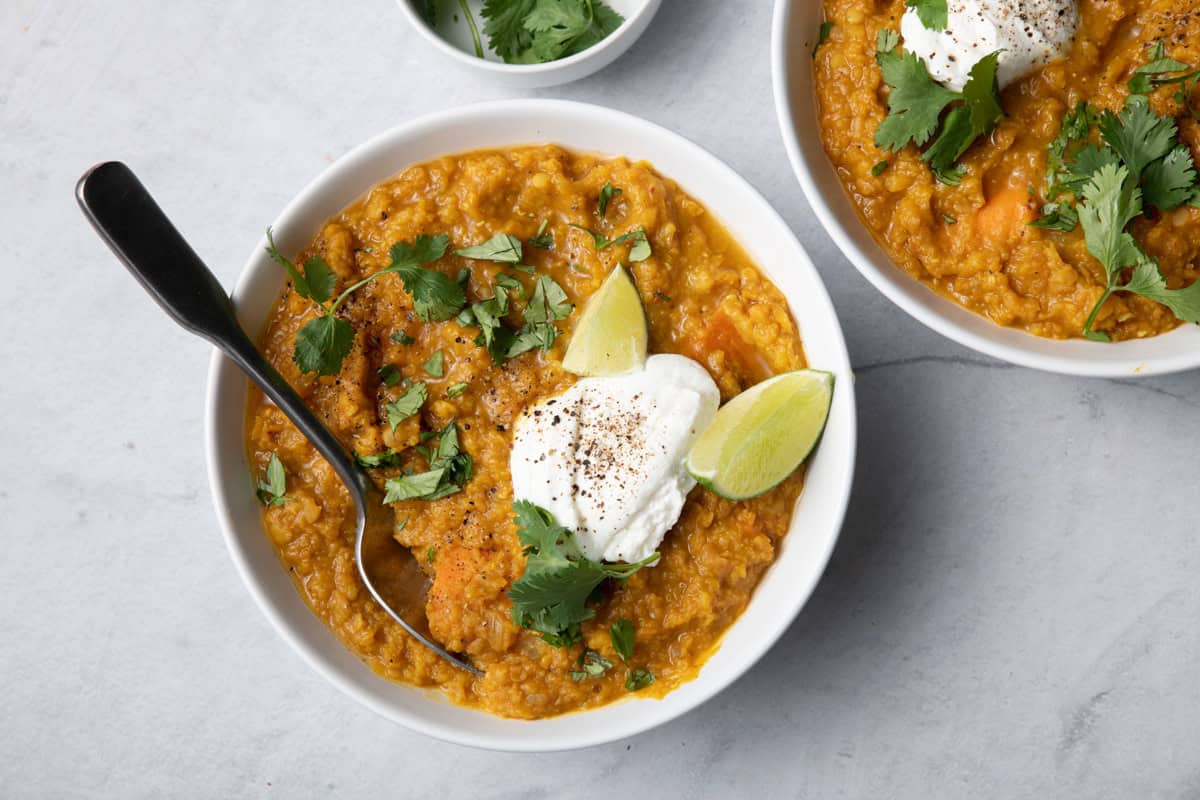 Easy red lentil curry topped with yogurt.