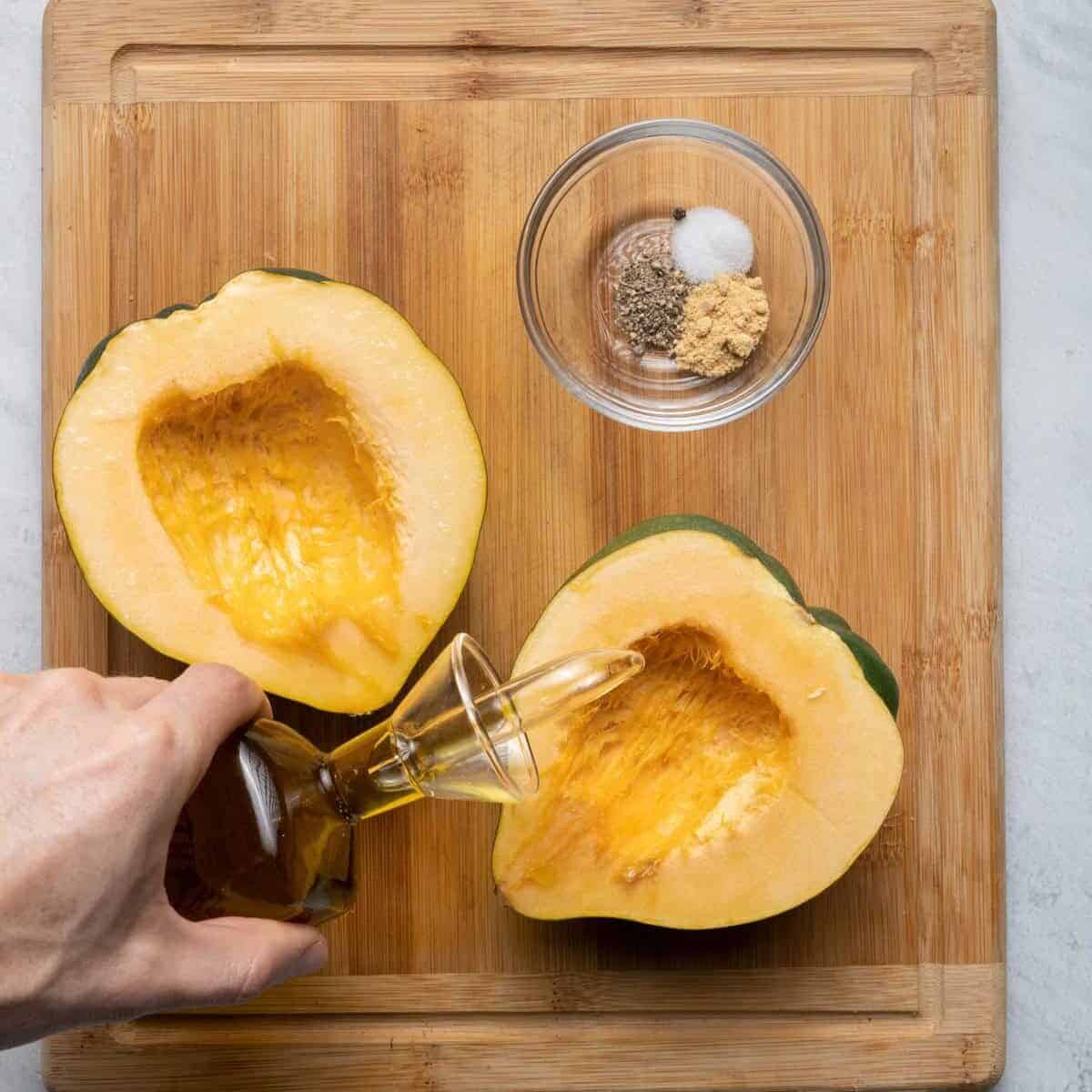 Acorn squash cut side up with olive oil, salt and pepper.