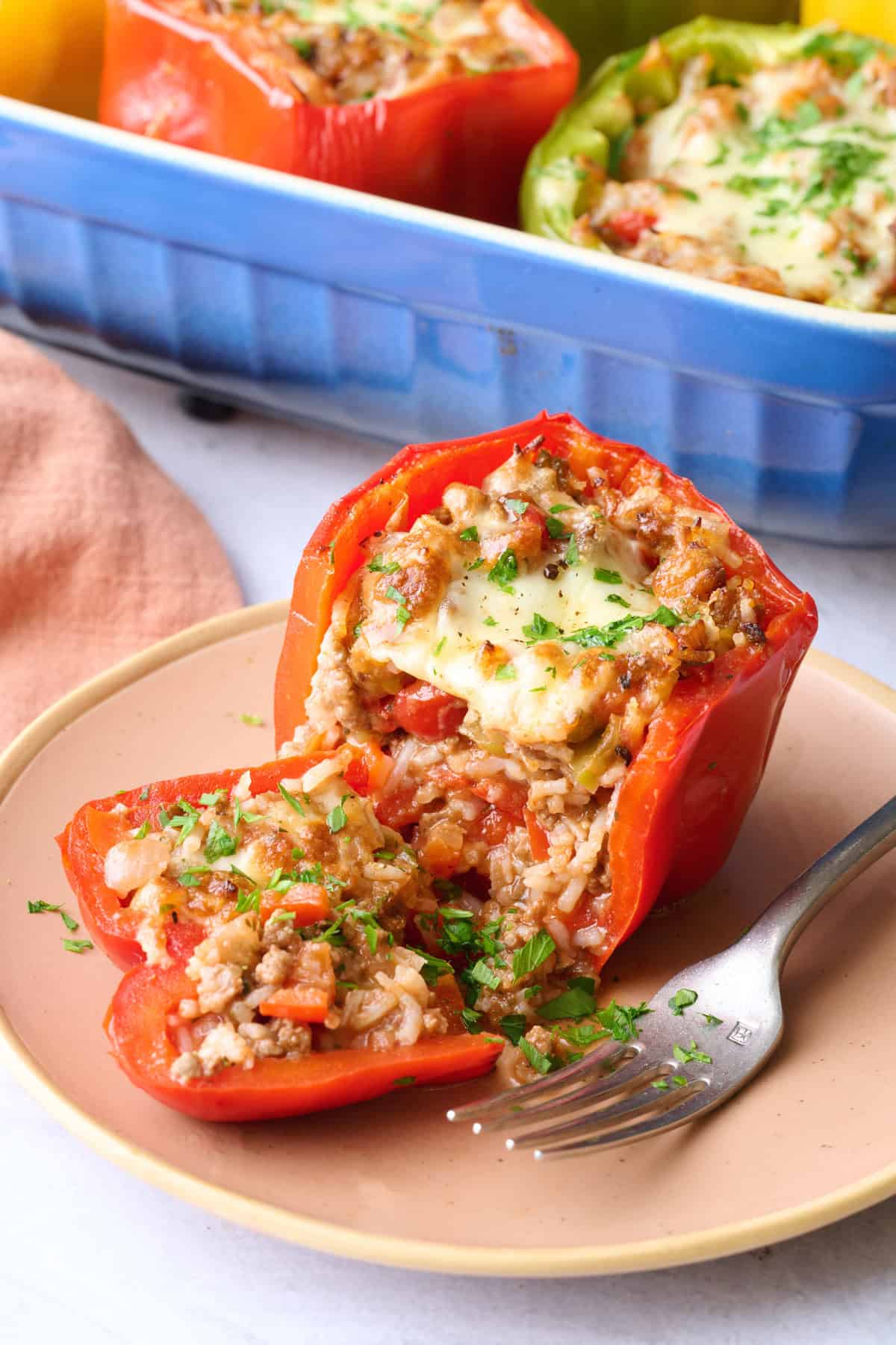 Old fashioned stuffed bell peppers recipe filled with a ground beef, rice and tomato mixture.