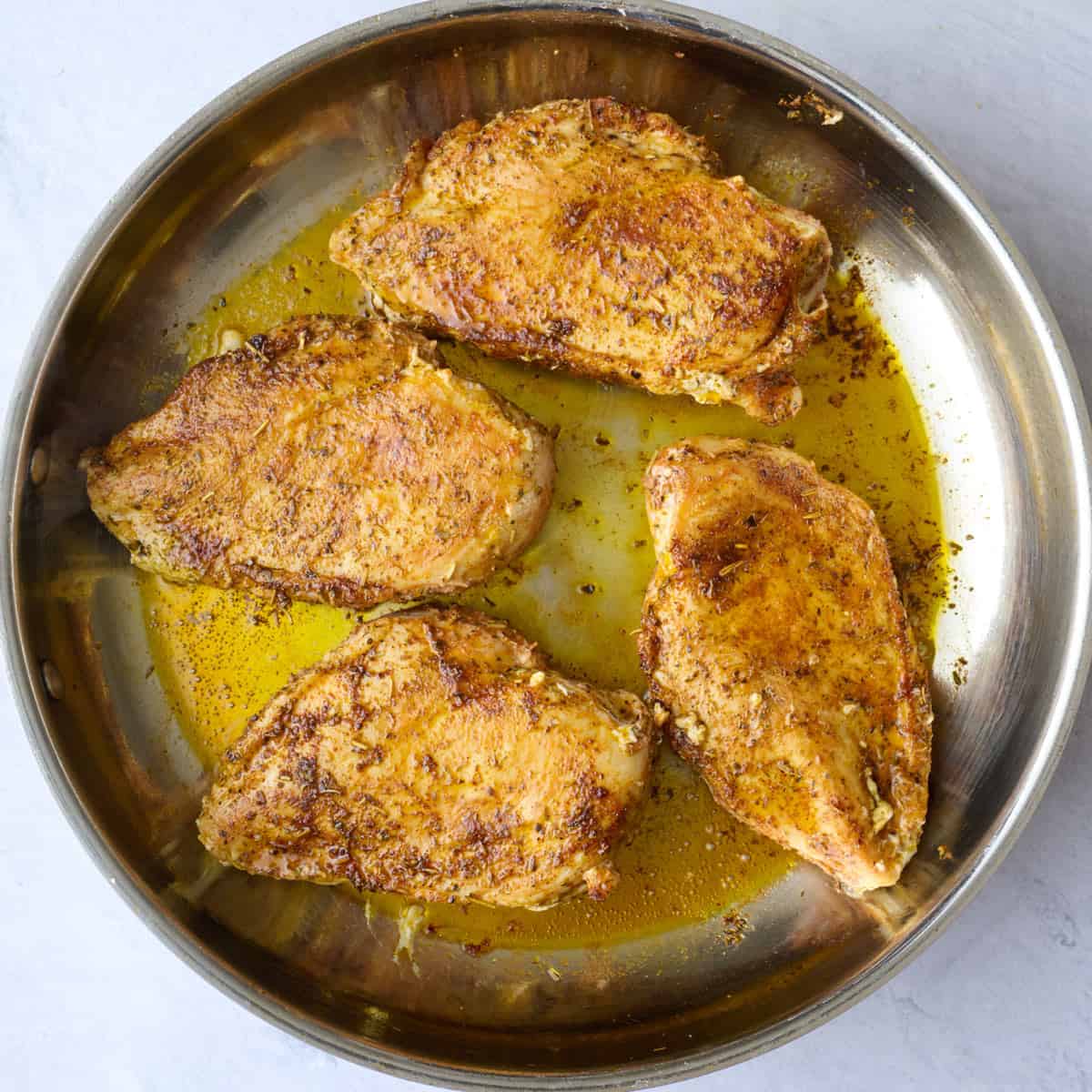 Chicken breasts after flipping and cooking through.