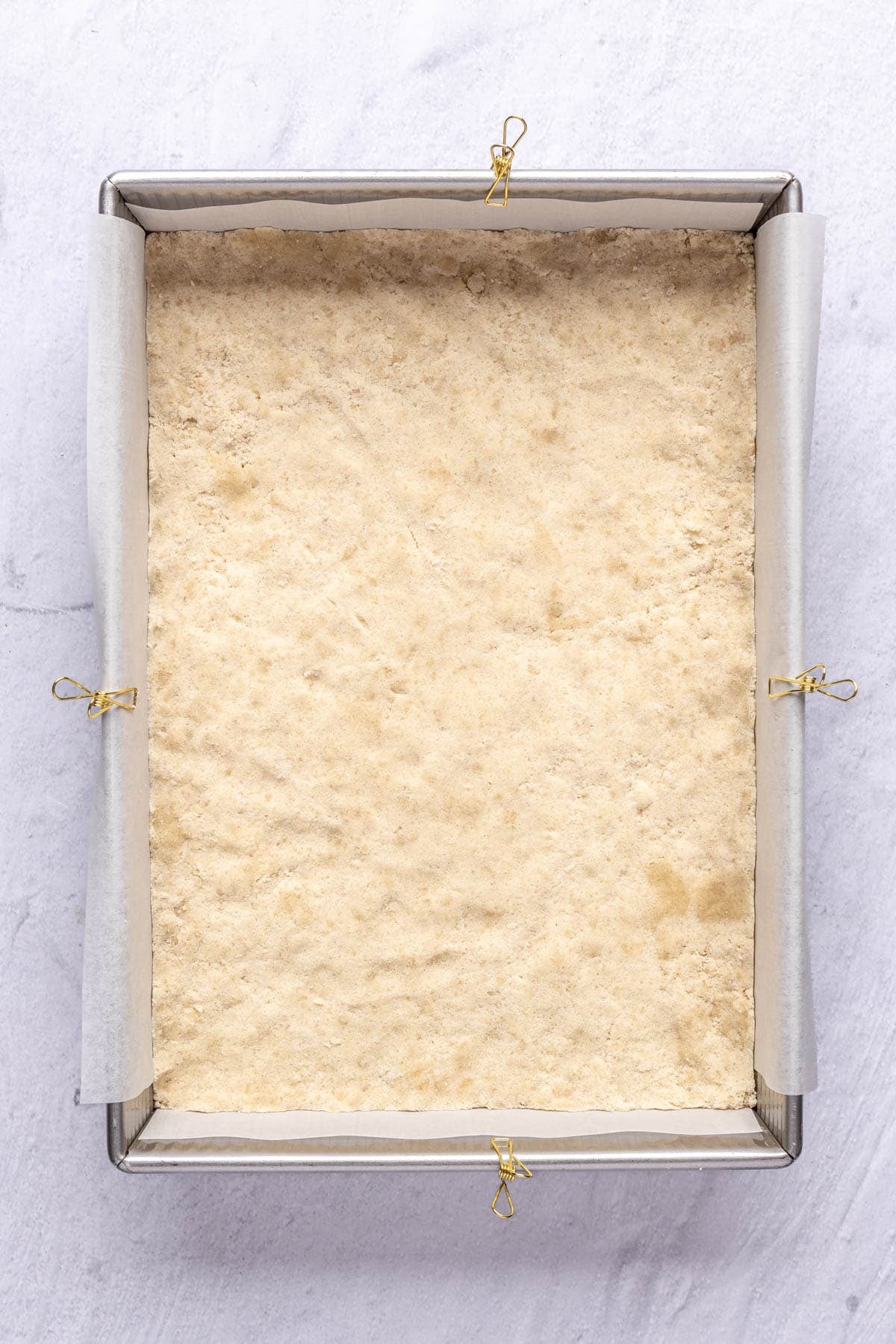 Crust mixture added to prepared baking dish after pressing into baking dish, before baking.
