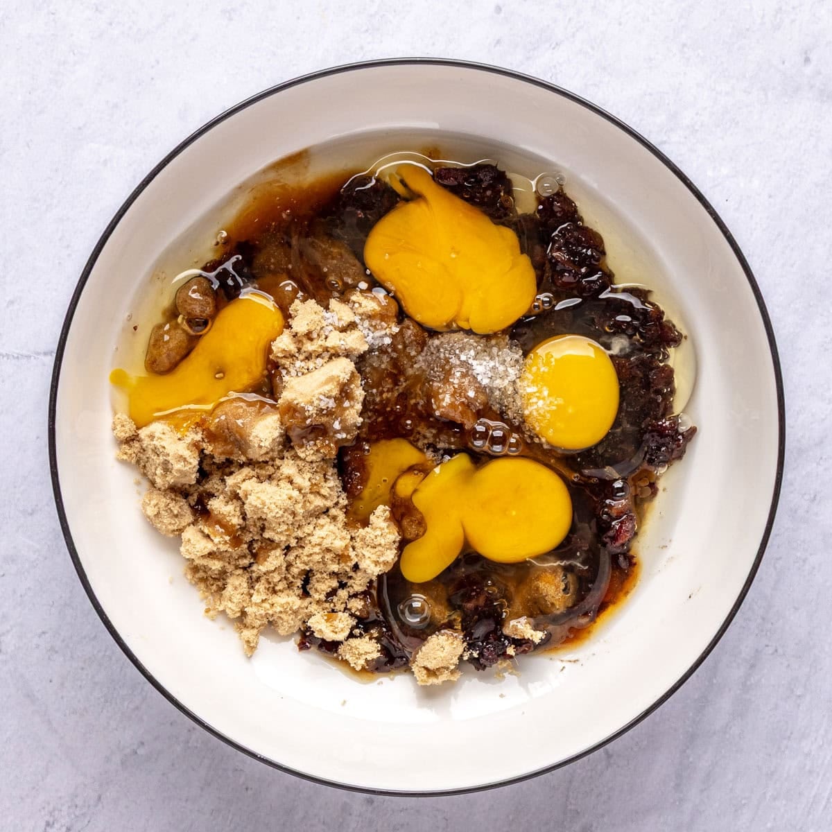 Cooled date paste, brown sugar, eggs, vanilla and salt in a large bowl before mixing for pecan filling.