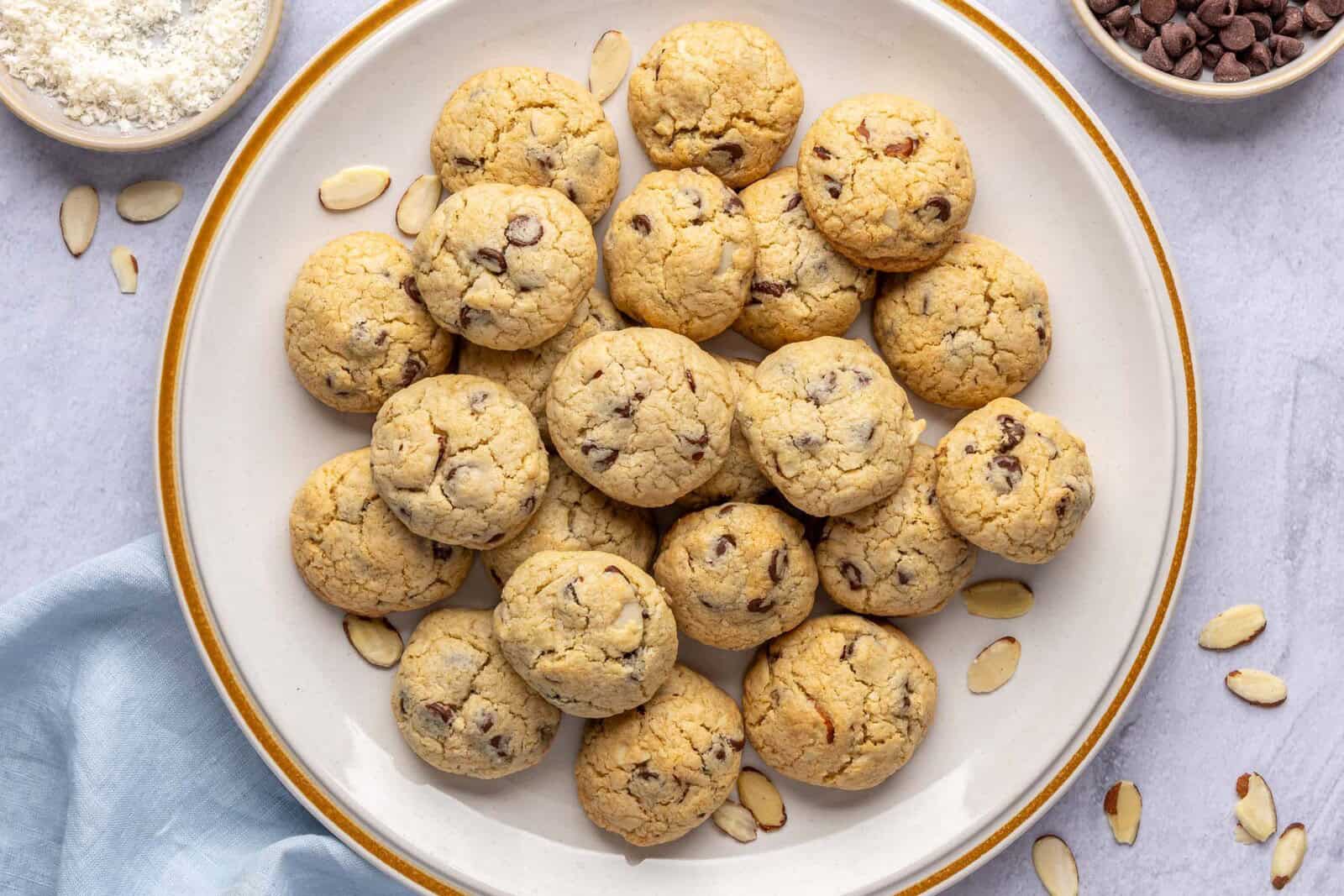 Best almond joy cookies made with shredded coconut, chocolate chips and sliced almonds on a large serving plate.