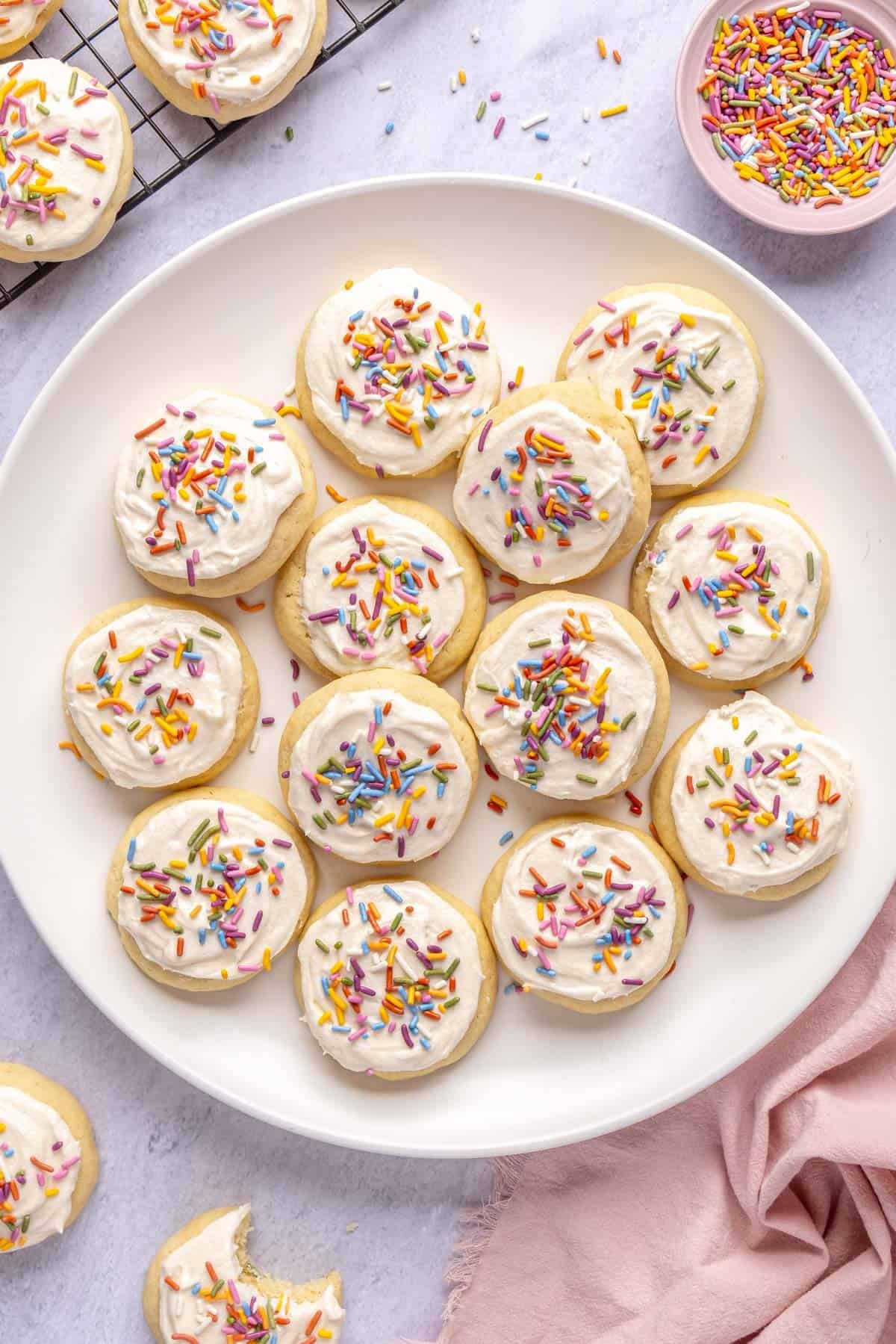 Soft baked Lofthouse sugar cookies recipe with buttercream frosting and colorful sprinkles.