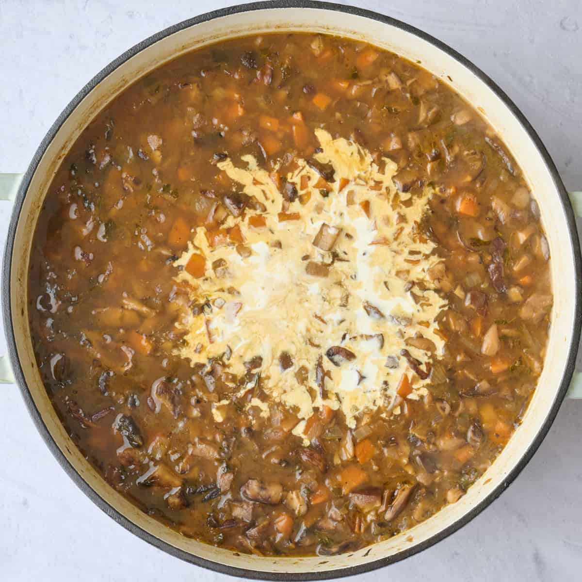 Mushroom soup after rice has cooked with cream added before combining.