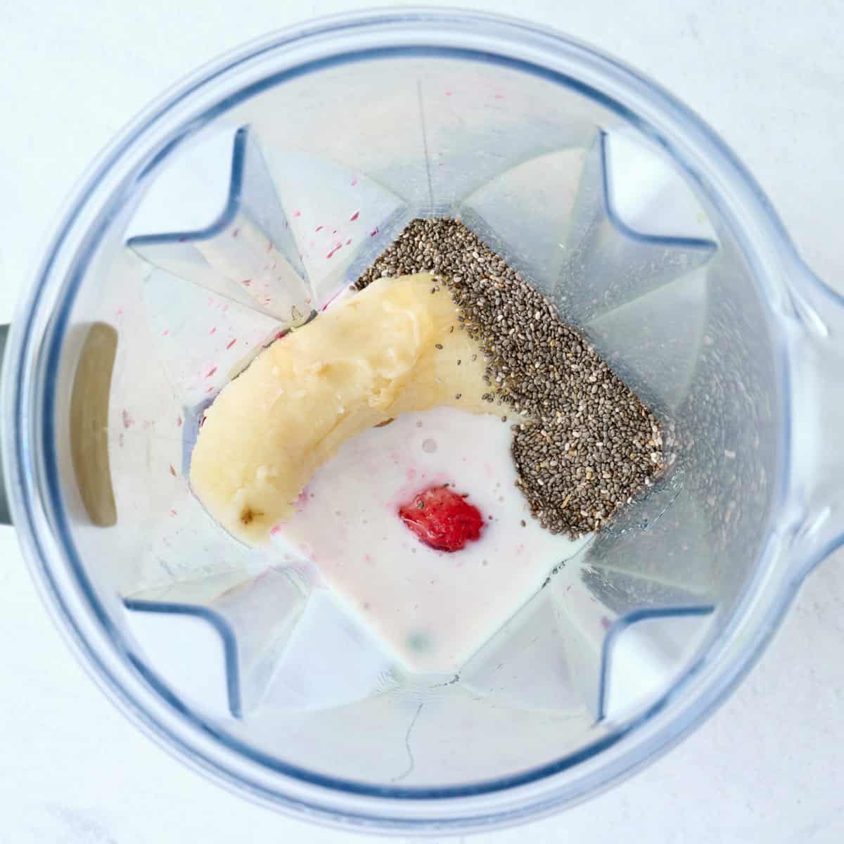 Chia seed smoothie ingredients in a blender before blending.