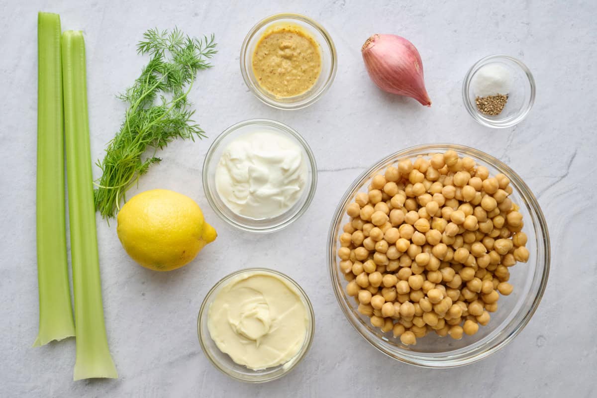 Ingredients for recipe: chickpeas, celery, fresh dill, Dijon mustard, lemon, yogurt, mayo, shallot, salt and pepper.