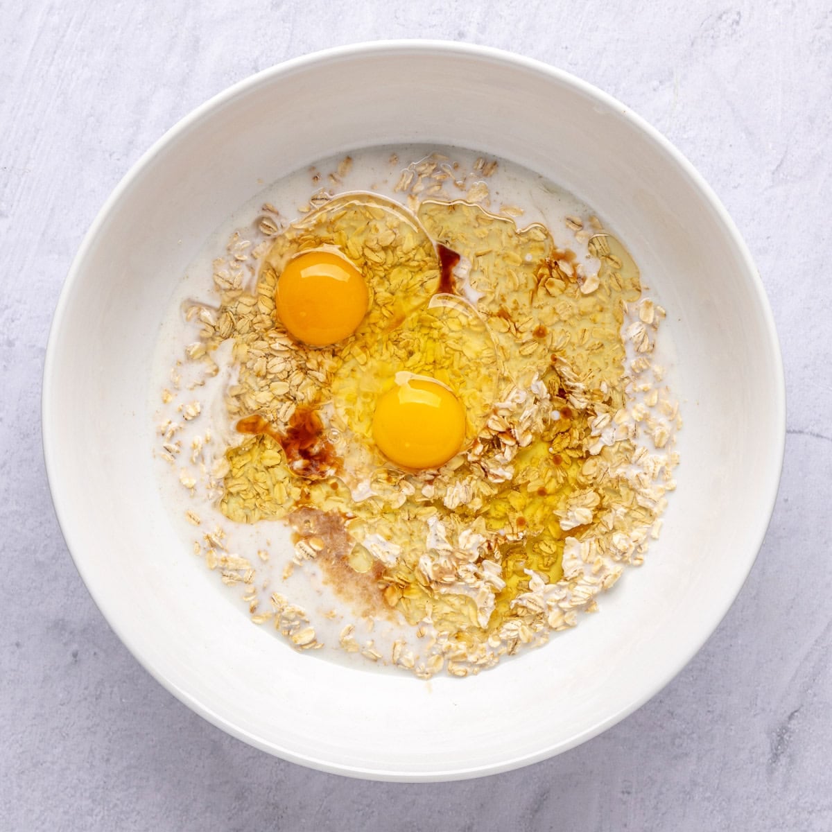 After soaking oats in milk with eggs, oil and vanilla added before whisking.