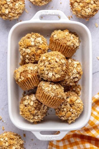 Oatmeal breakfast muffins with an oat crumb topping in a small dish.