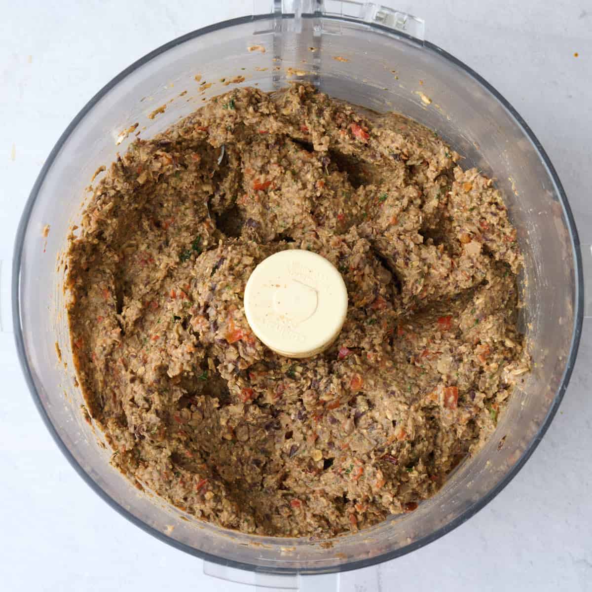 Veggie burger mixture in a food processor after processing.