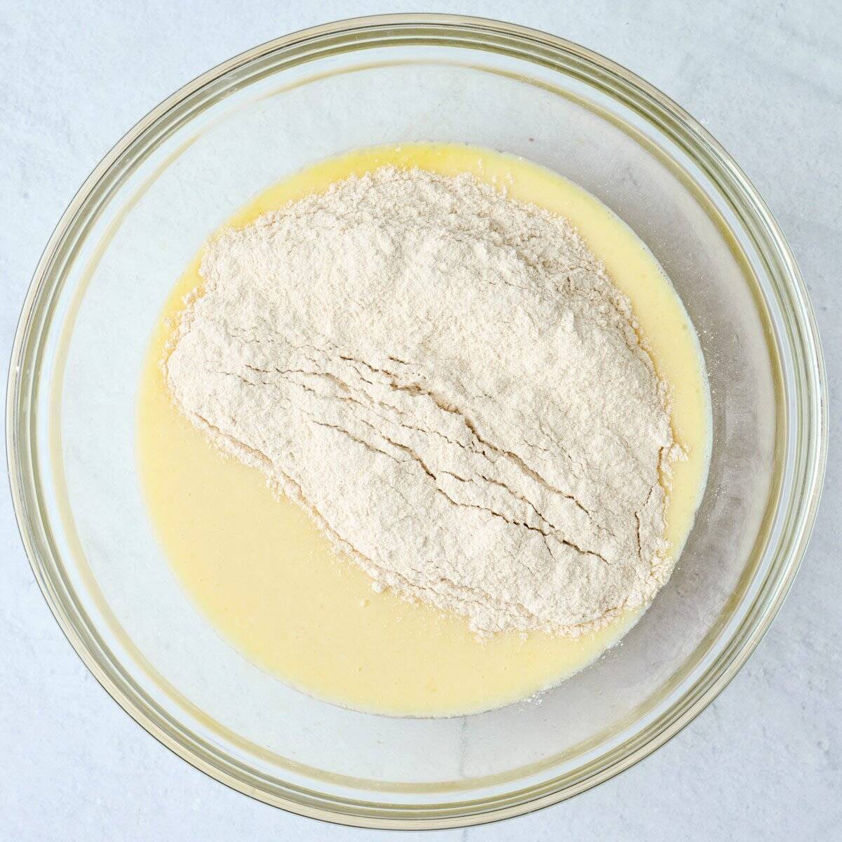 Pancake dry mixture added on top of wet mixture before combining.