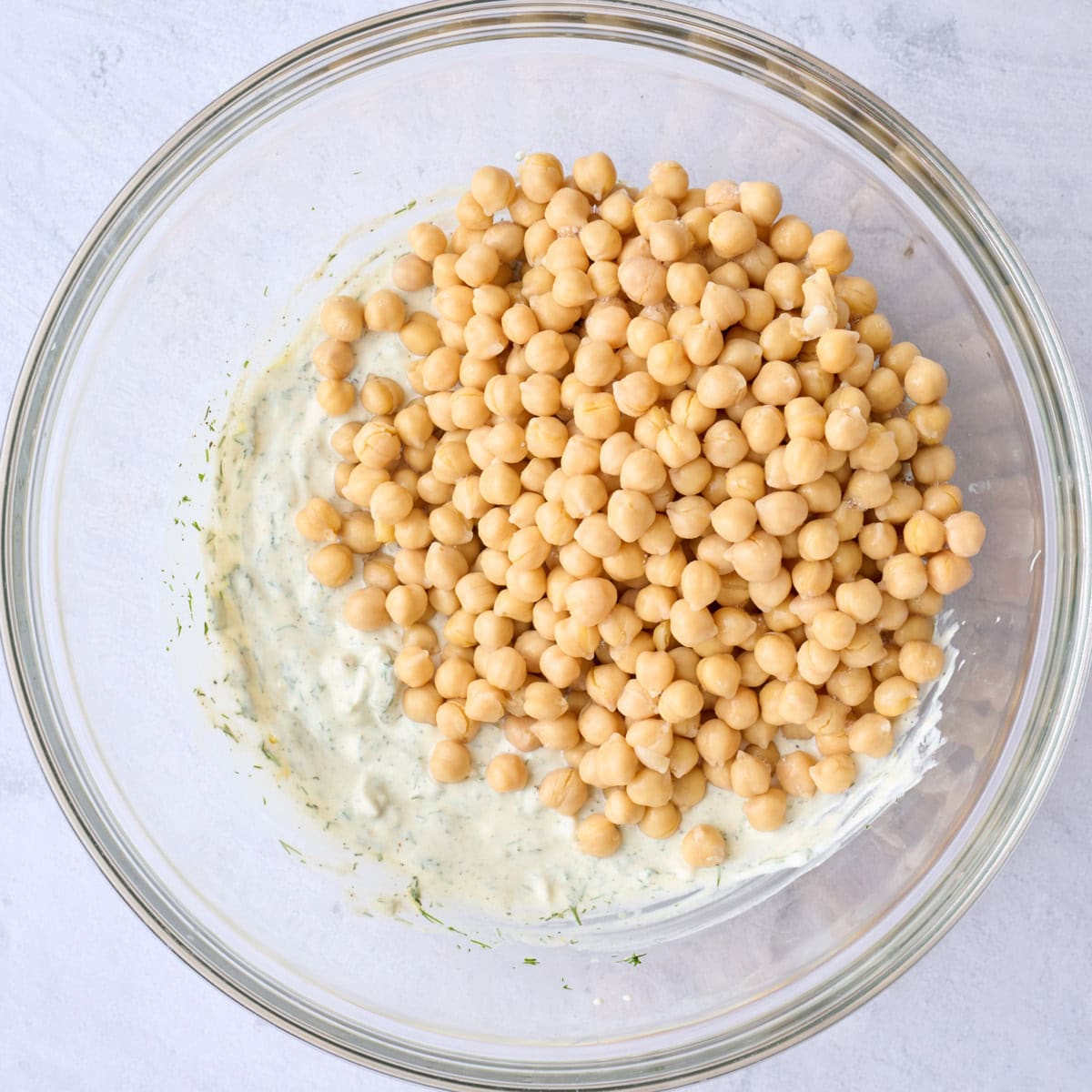 Dressing after emulsified with chickpeas added on top.