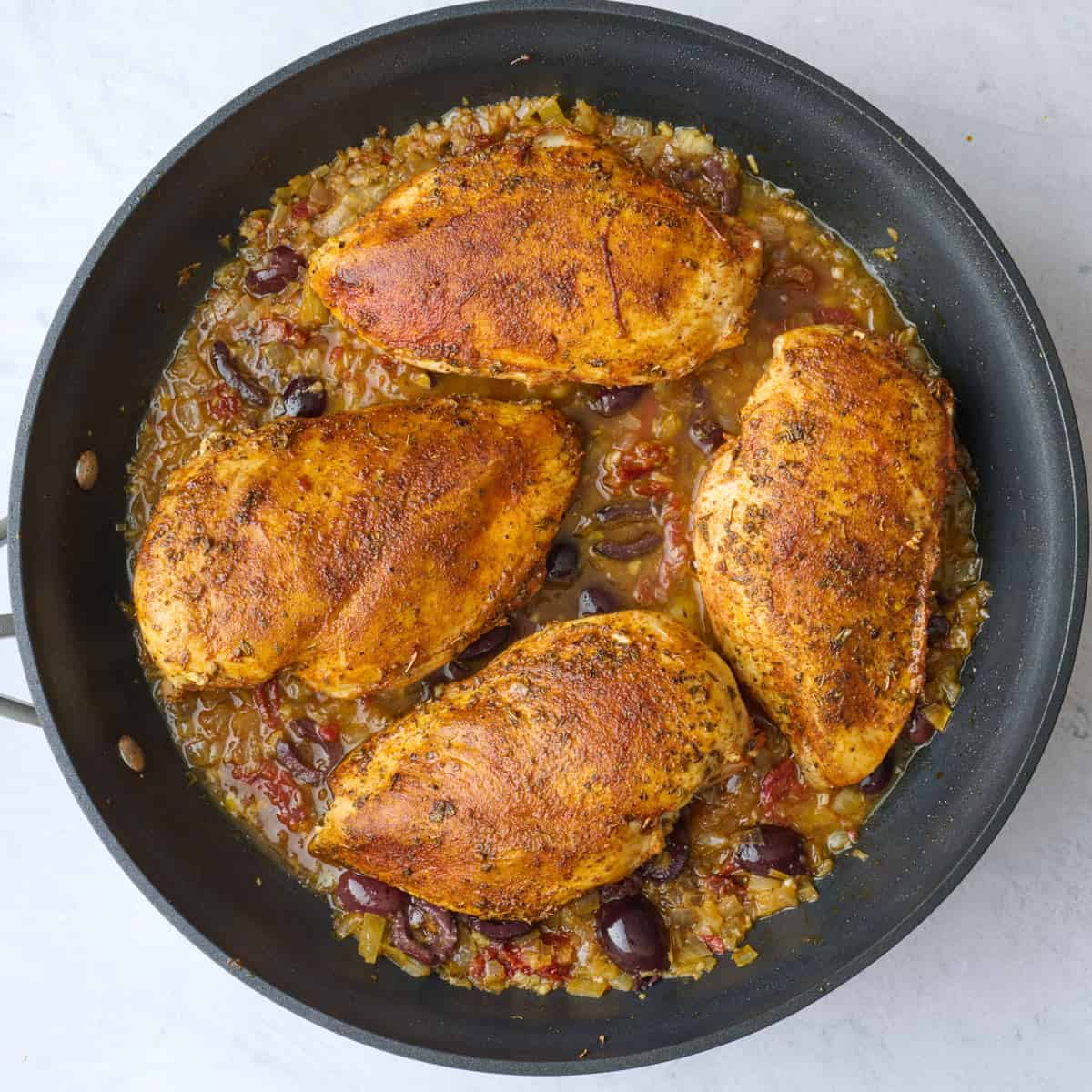 After broth is stirred into mixture with chicken breast added back to pan.