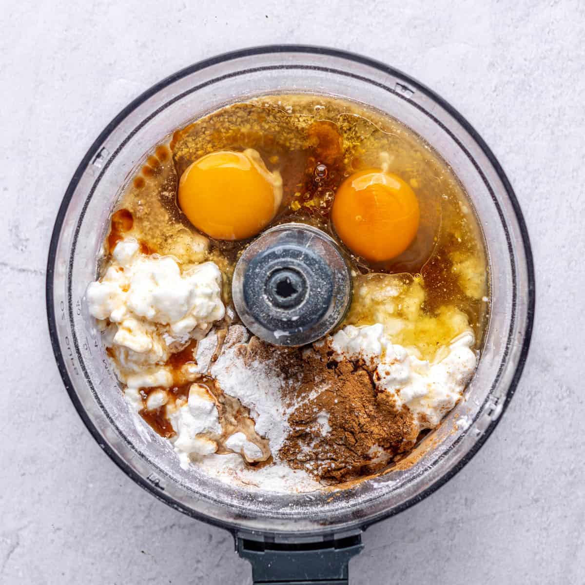 Oats after processing with eggs, cottage cheese, maple syrup, oil, vanilla, baking powder, cinnamon and salt added before mixing.