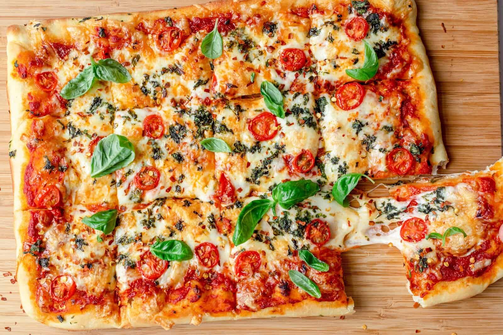Best sheet pan pizza recipe with a simple dough and sauce.
