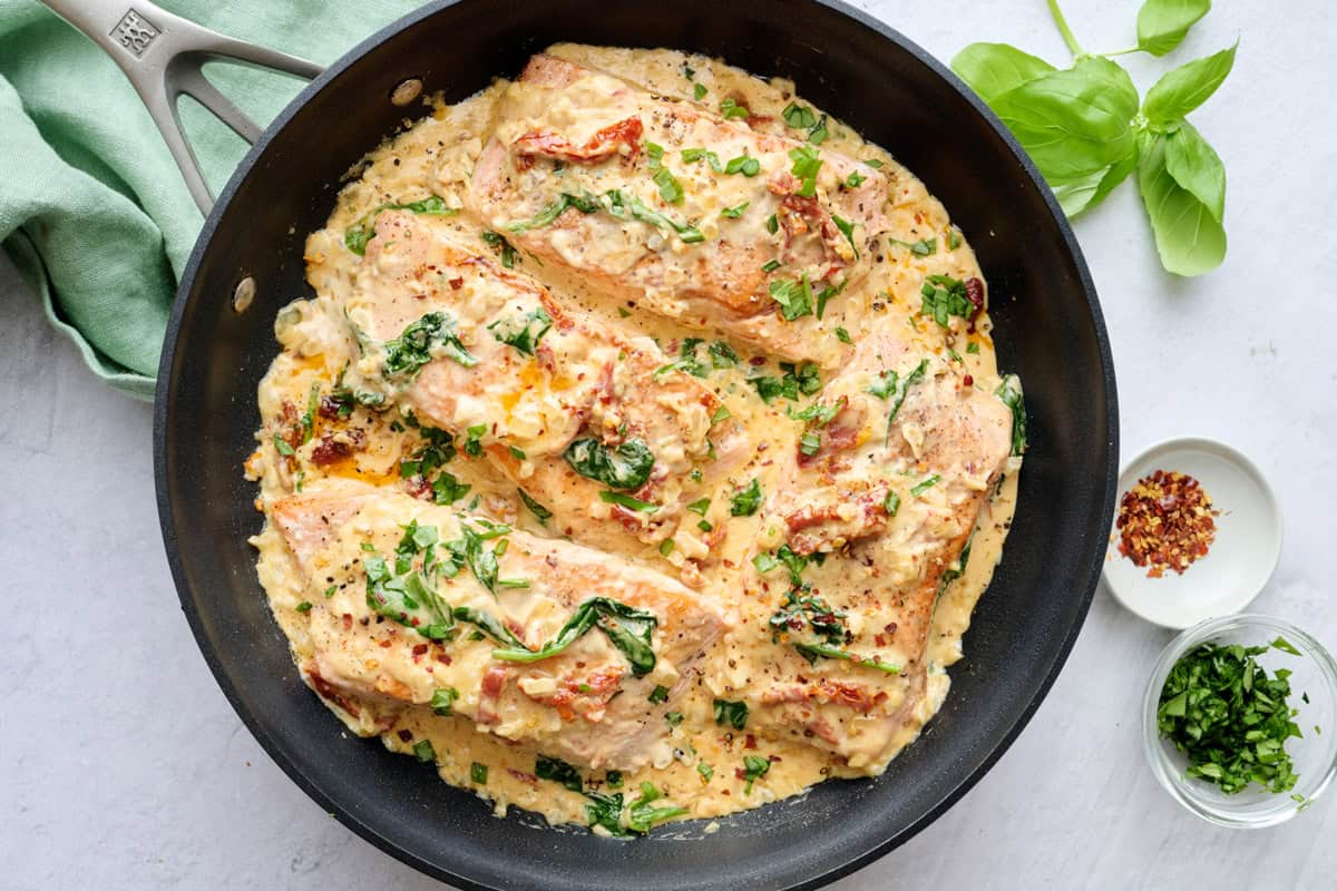 Easy creamy Tuscan salmon recipe in a skillet.