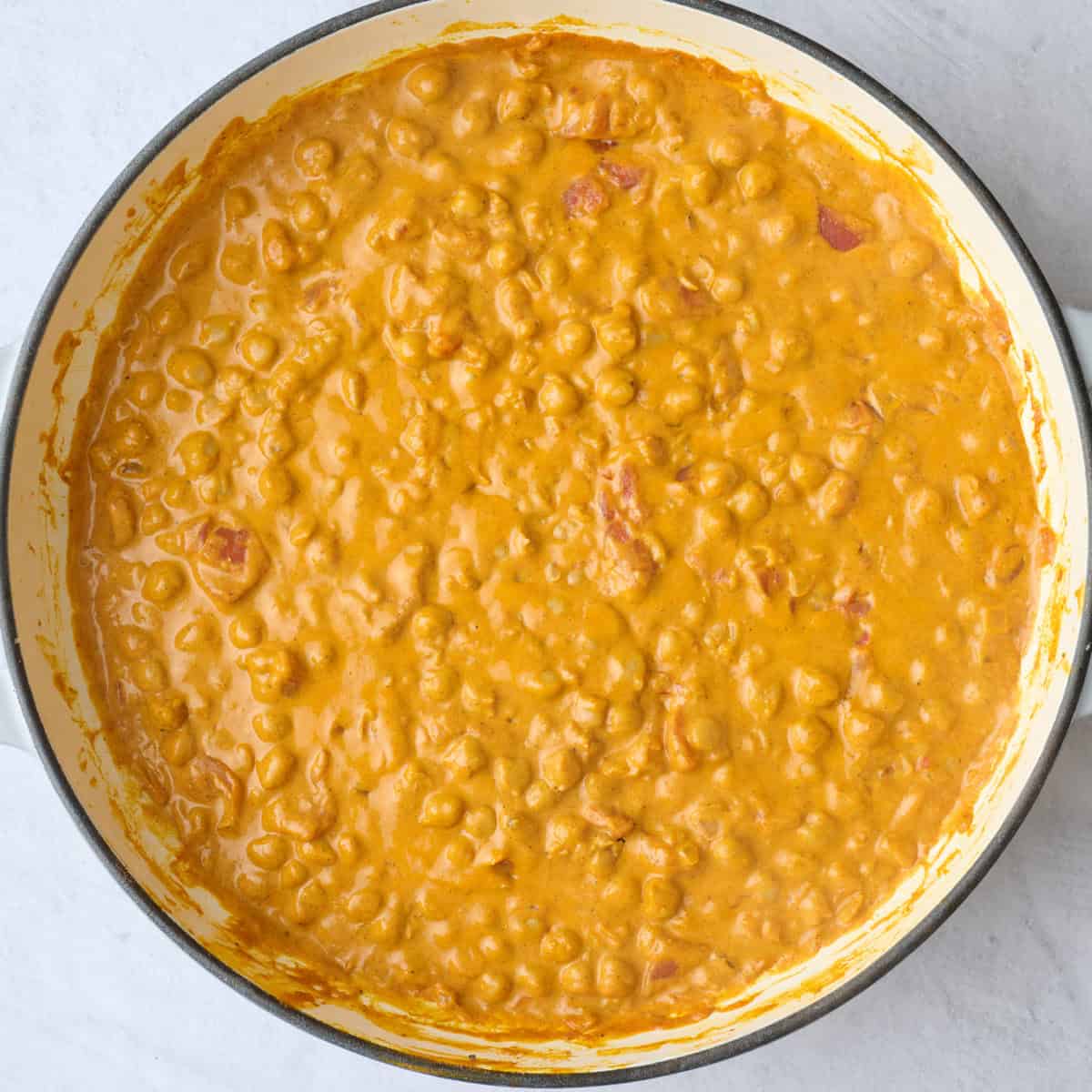 The curry in a skillet after all of the ingredients are combined and cooked.