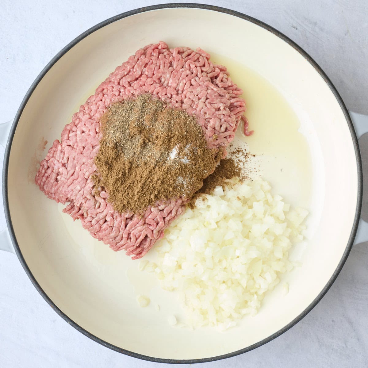 Lean ground beef, onions, and warm Middle Eastern spices before cooking.
