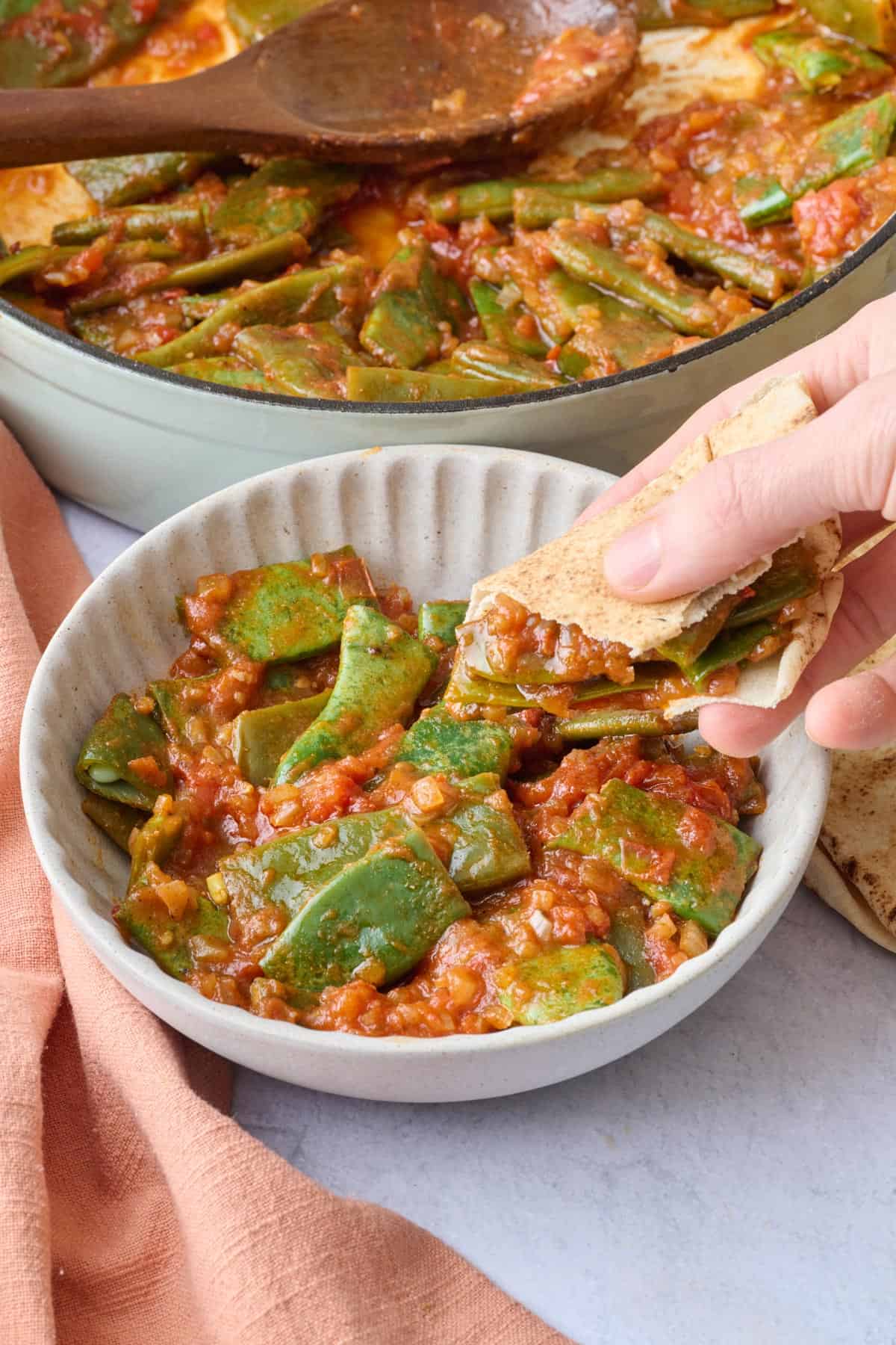 Pita scooping up some homemade lebanese green beans recipe.