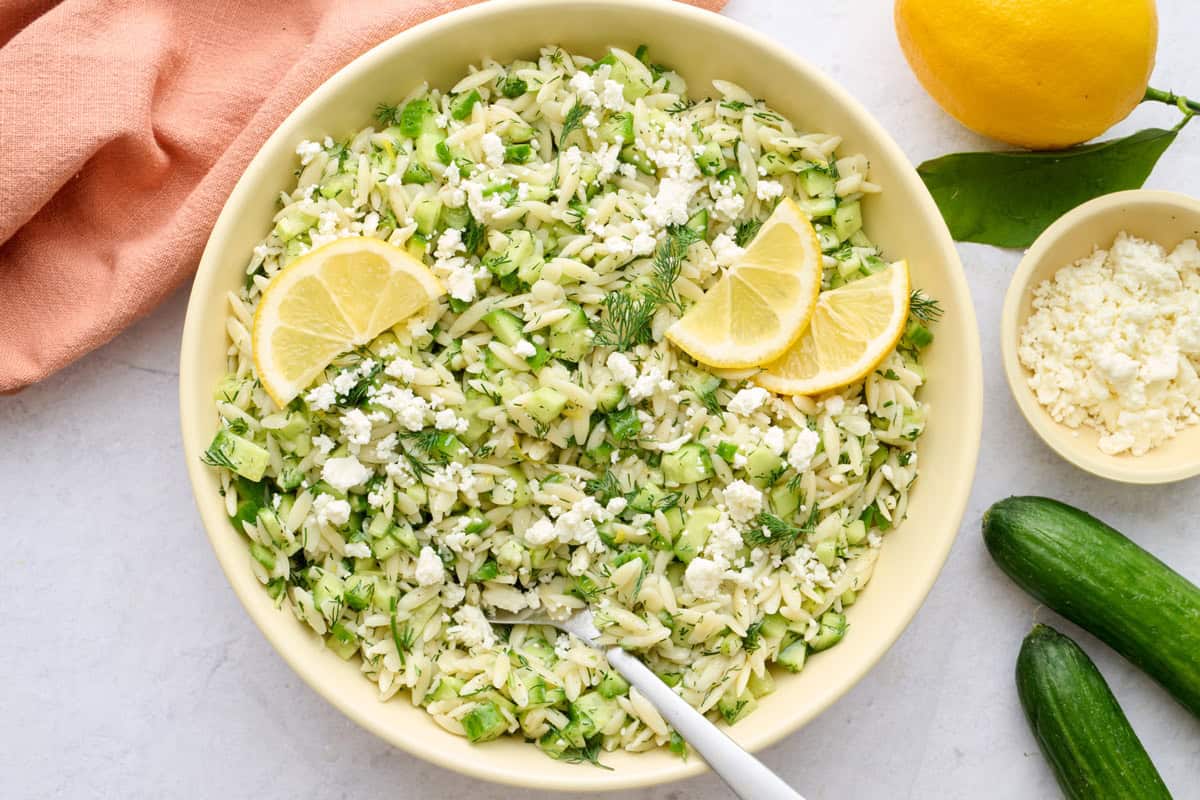 Quick lemon orzo salad recipe in a serving bowl with crumbled feta.