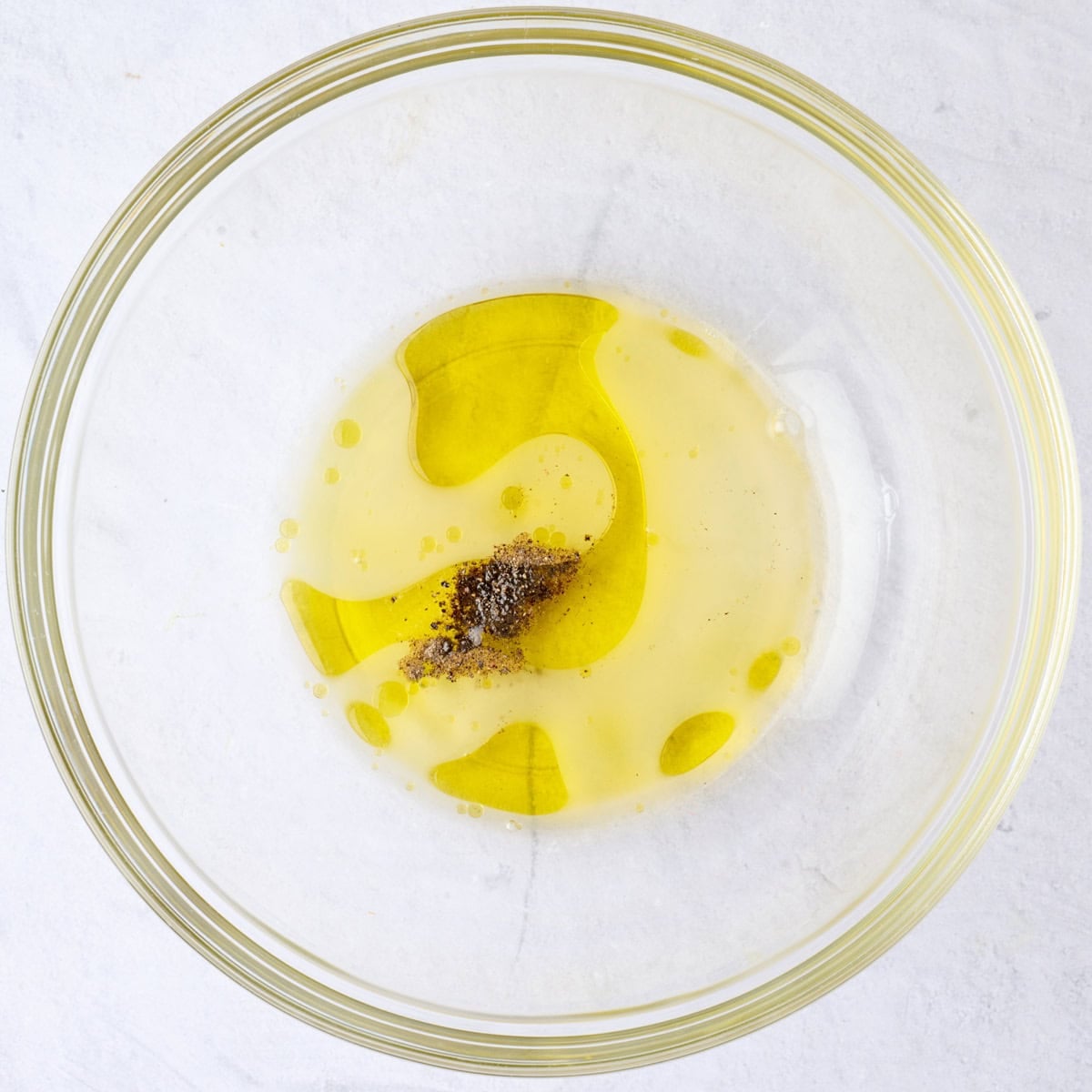 Salad dressing ingredients in a bowl before mixing.