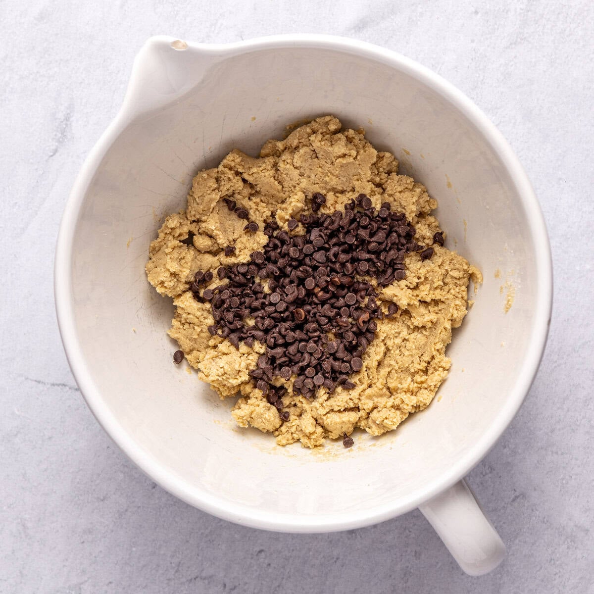 After folding together energy ball mixture with chocolate chips added on top before combining.