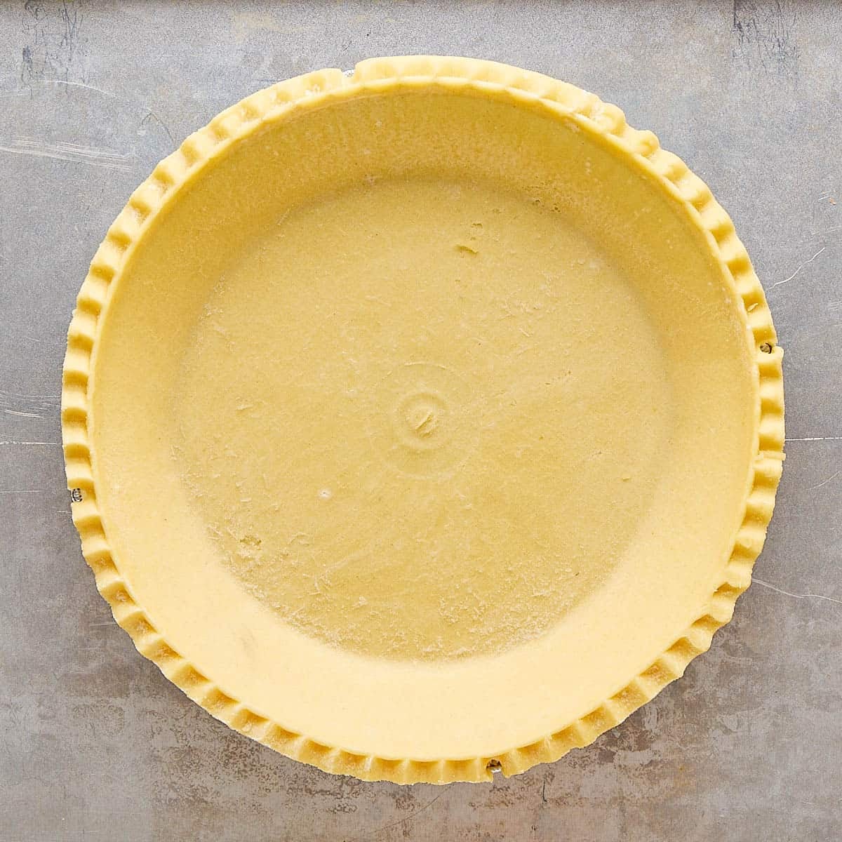 Prepared pie crust on a sheet pan.