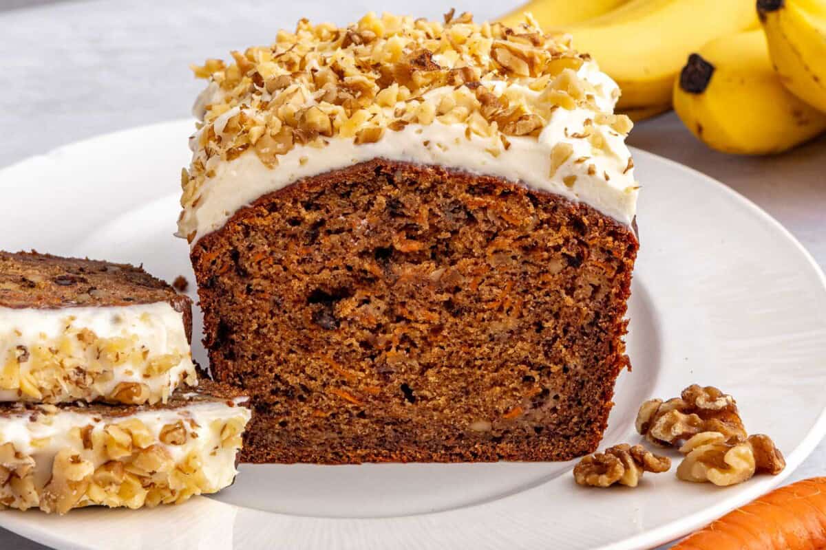 Easy quick bread recipe for carrot banana bread with cream cheese frosting with walnuts.