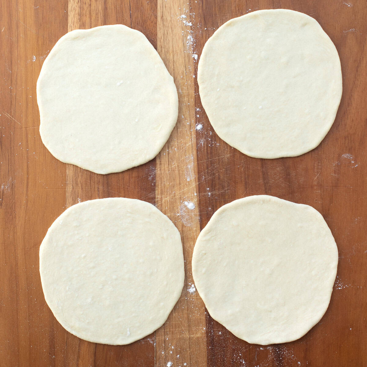 After flattening dough balls out into small round discs.