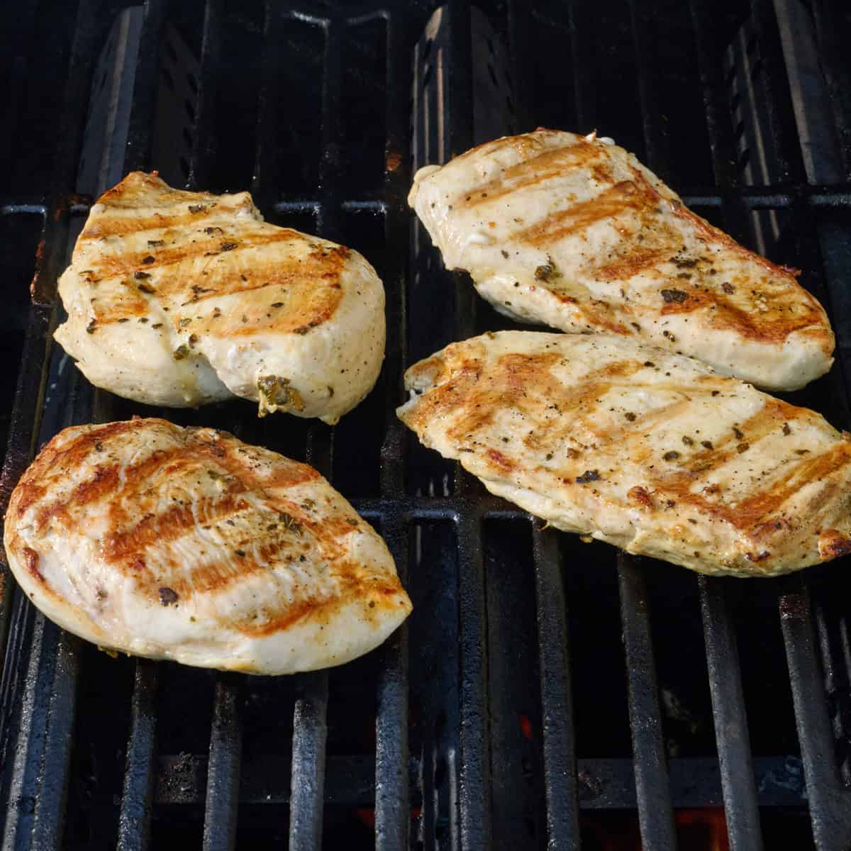 Chicken on the grill after flipping.