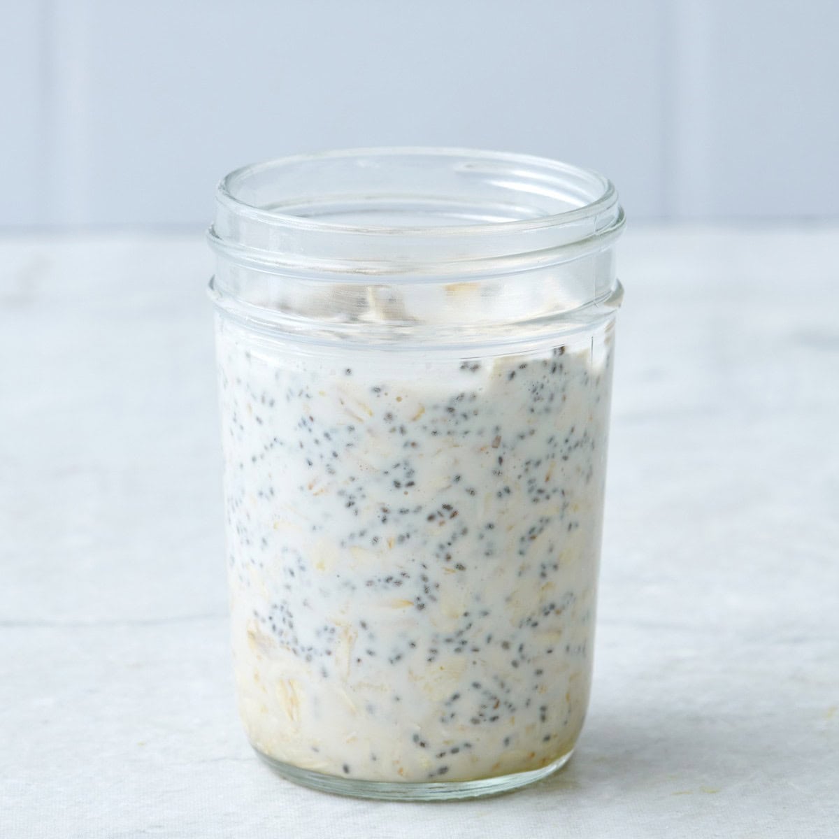Oats in a jar before storing overnight.